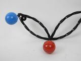 a picture of a necklace with two balls attached to it