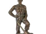 bronze statue of a man with a rifle and a dog