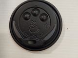 a close up of a black lid on a stove