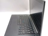 a laptop that is open on a white surface