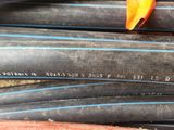 many different types of hoses stacked together on the ground