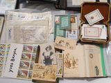 a lot of books and postcards sitting on a table