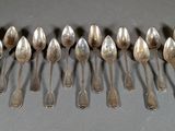 a lot of spoons that are sitting on a table
