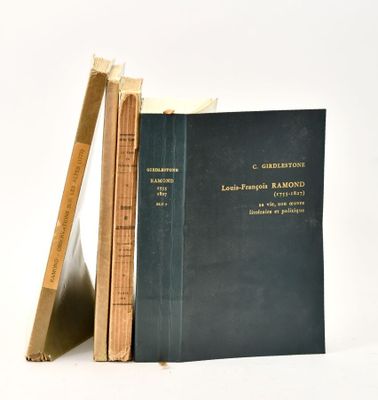 two books sitting on top of each other next to a ruler