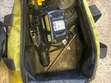 a bag with tools inside of it on the floor