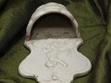 a small white object that is on a green cloth