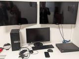 two monitors and a keyboard on the desk