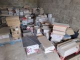 a pile of boxes and boxes sitting on the floor