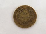 a small coin that is sitting on a white surface