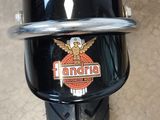 a close up of a motorcycle with a logo on it
