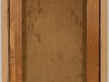 an old picture frame hanging on a wall next to a white wall