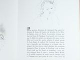 an open book with a drawing of a woman on it