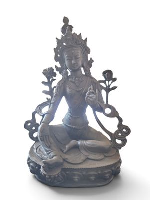 statue of a woman sitting in a lotus position with a flower in her hand