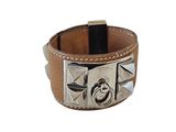 leather cuff bracelet with silver metal studs on a white background