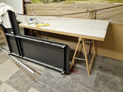 a television sitting on a table in the middle of a room
