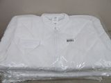 a white shirt wrapped in plastic on top of a table