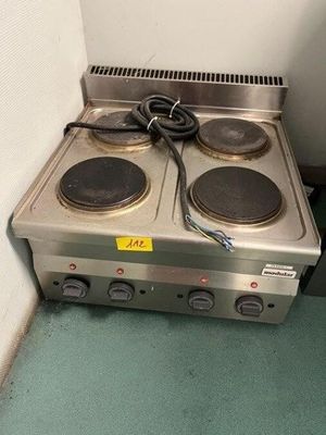 two burners on the stove in the corner of the room