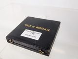 a black book sitting on top of a glass table