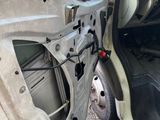 the door of a car with the door open and the driver ' s door open
