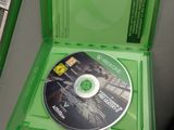 a green box with a cd inside of it