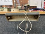 a picture of a desk with a bunch of wires attached to it
