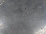 a metal pan that has a handle on it