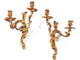 pair of antique gold leaf sconces on a white background