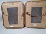 two pieces of luggage are wrapped up and ready to be packed