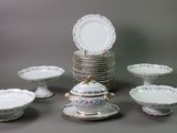 a lot of plates and bowls on the table