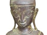an old statue of a person with a hat on his head
