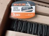 a box with a brush in it sitting on a table