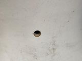 a small hole in the bottom of a toilet seat