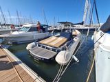 many boats that are docked in the water at the dock