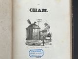 an open book with a picture of a train coming out of it