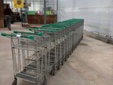 many shopping carts lined up inside of a building