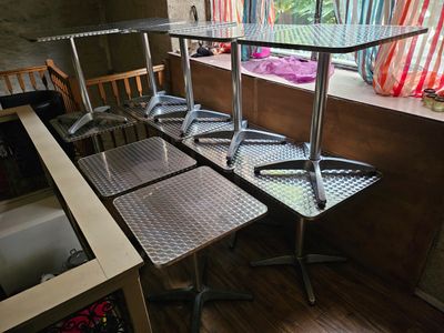 four chairs and a table in the corner of a room