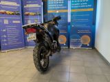 a motorcycle that is parked in front of a wall