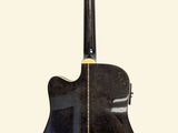 an image of a black guitar sitting on top of a white background