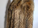 an image of a fur coat on a mannequin stand