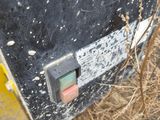 a close up of a piece of equipment that is in the grass