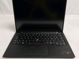 a black laptop with a red button on the keyboard