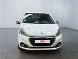 the front view of a white car parked in a showroom
