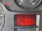 a digital clock on the dashboard of a car