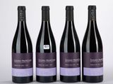 trois bouteilles de vin posées sur une table l'une à côté de l'autre
