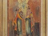 an old painting of a man with a beard holding a book