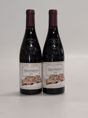 two bottles of wine sitting next to each other on a table