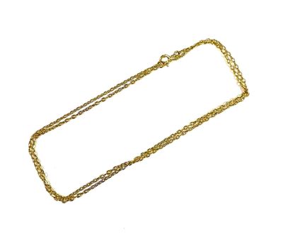 a close up of a gold chain on a white background