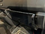 a close up of a car door handle with a metal latch
