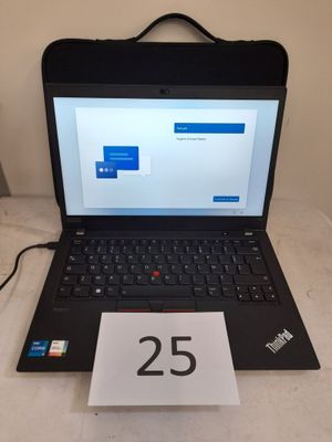 a laptop computer sitting on a table with a price tag attached to it