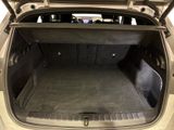 a trunk of a car that is empty with the back door open